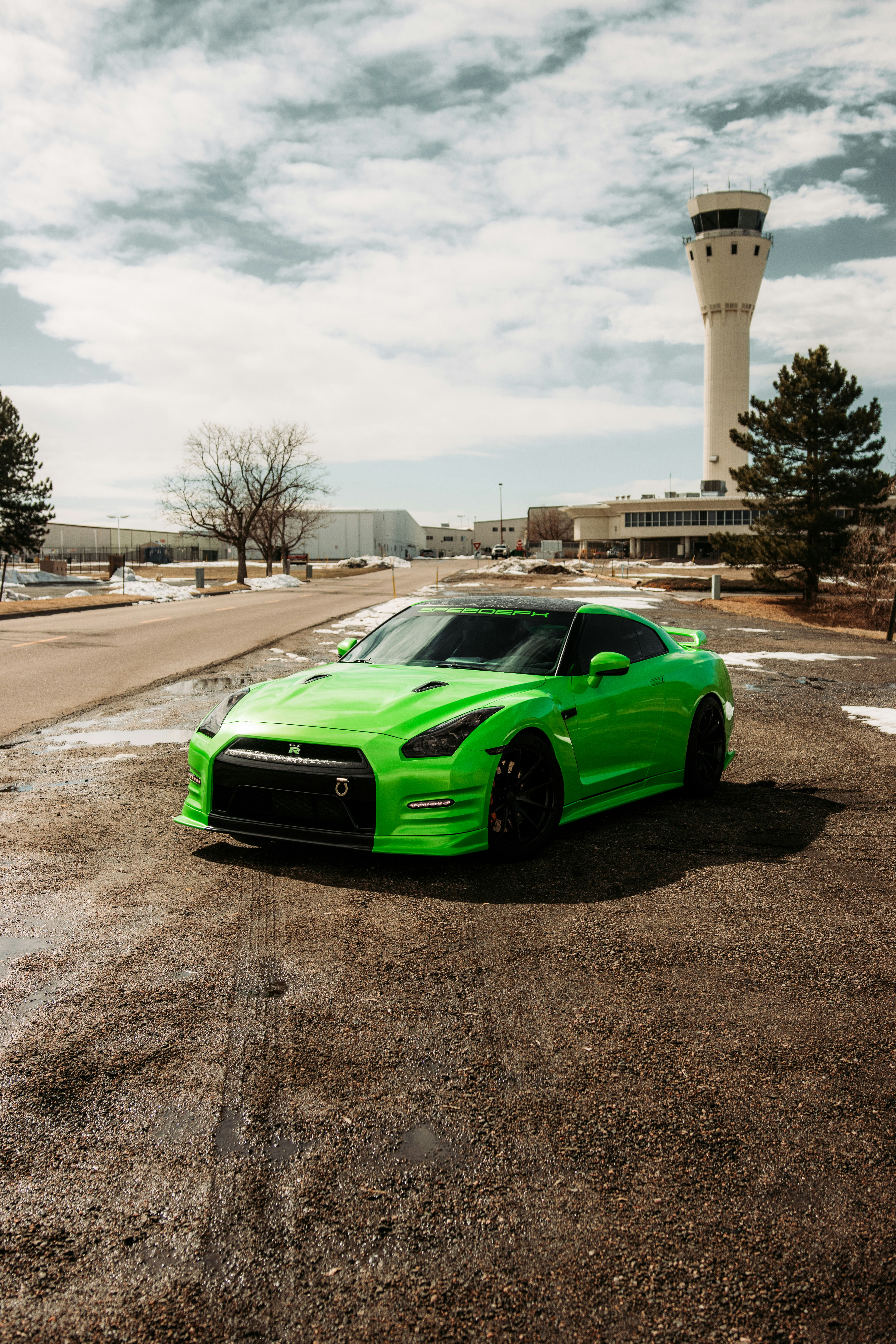 green chevrolet camaro on road during daytime